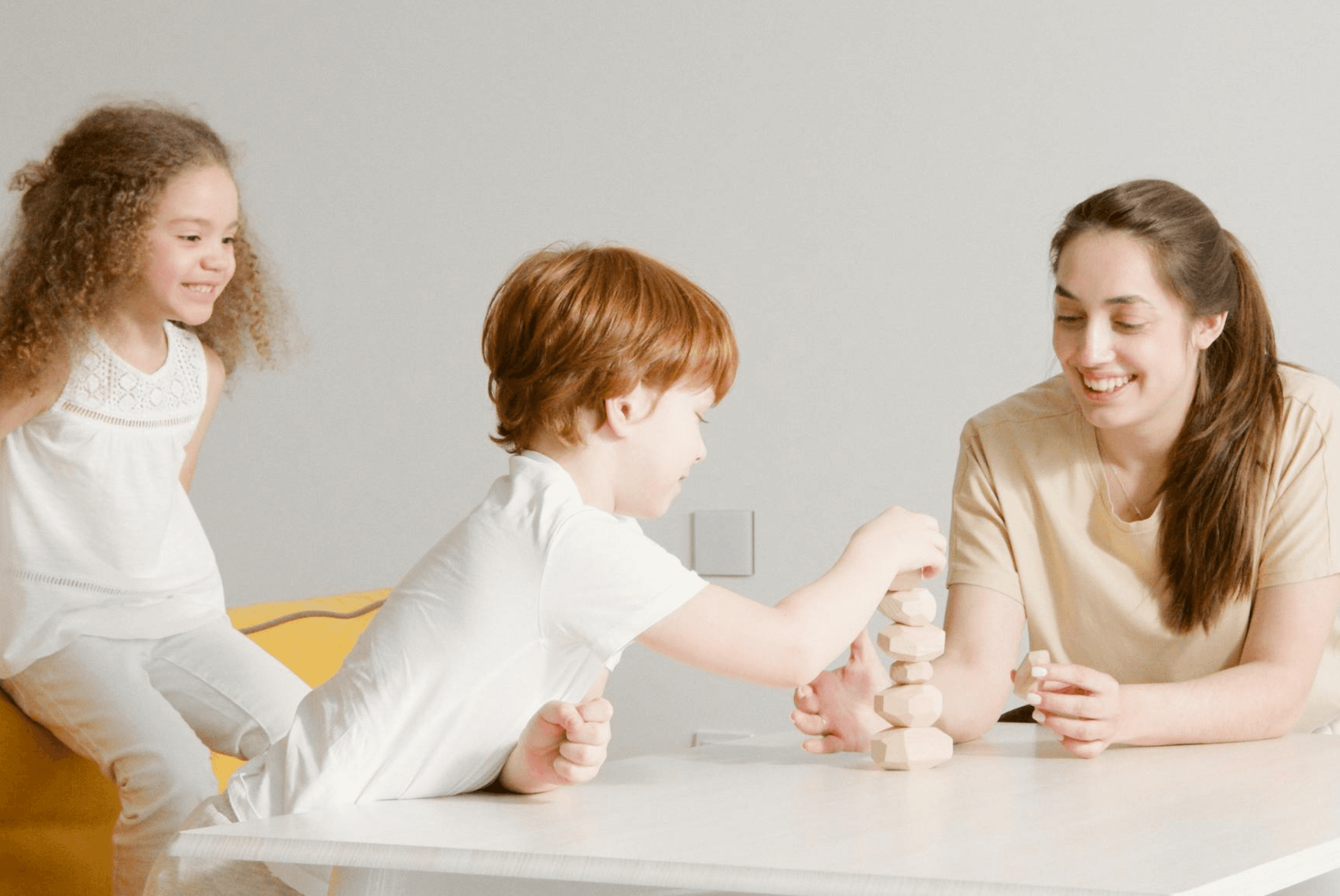 Nanny and children playing